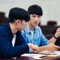 Two students speaking in class